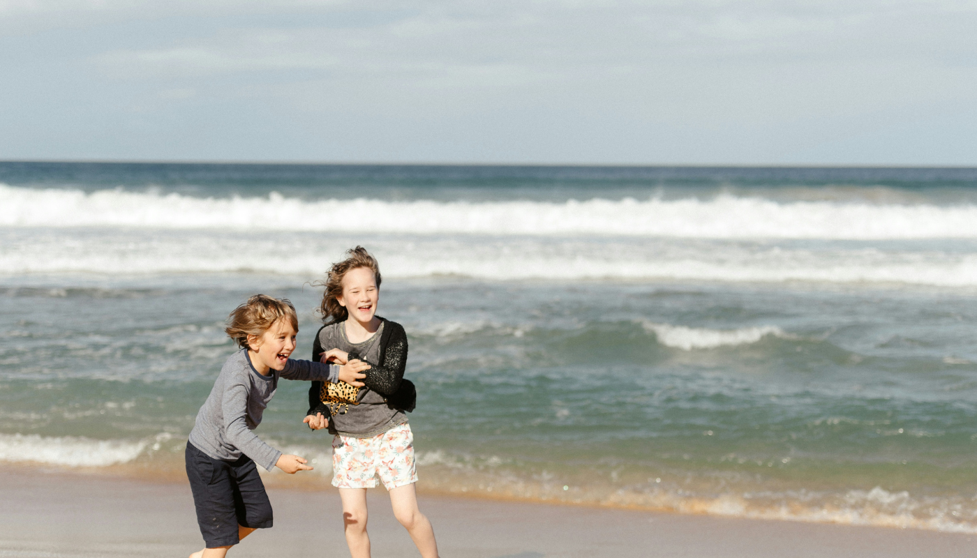 kids playing on the beach in northwest florida